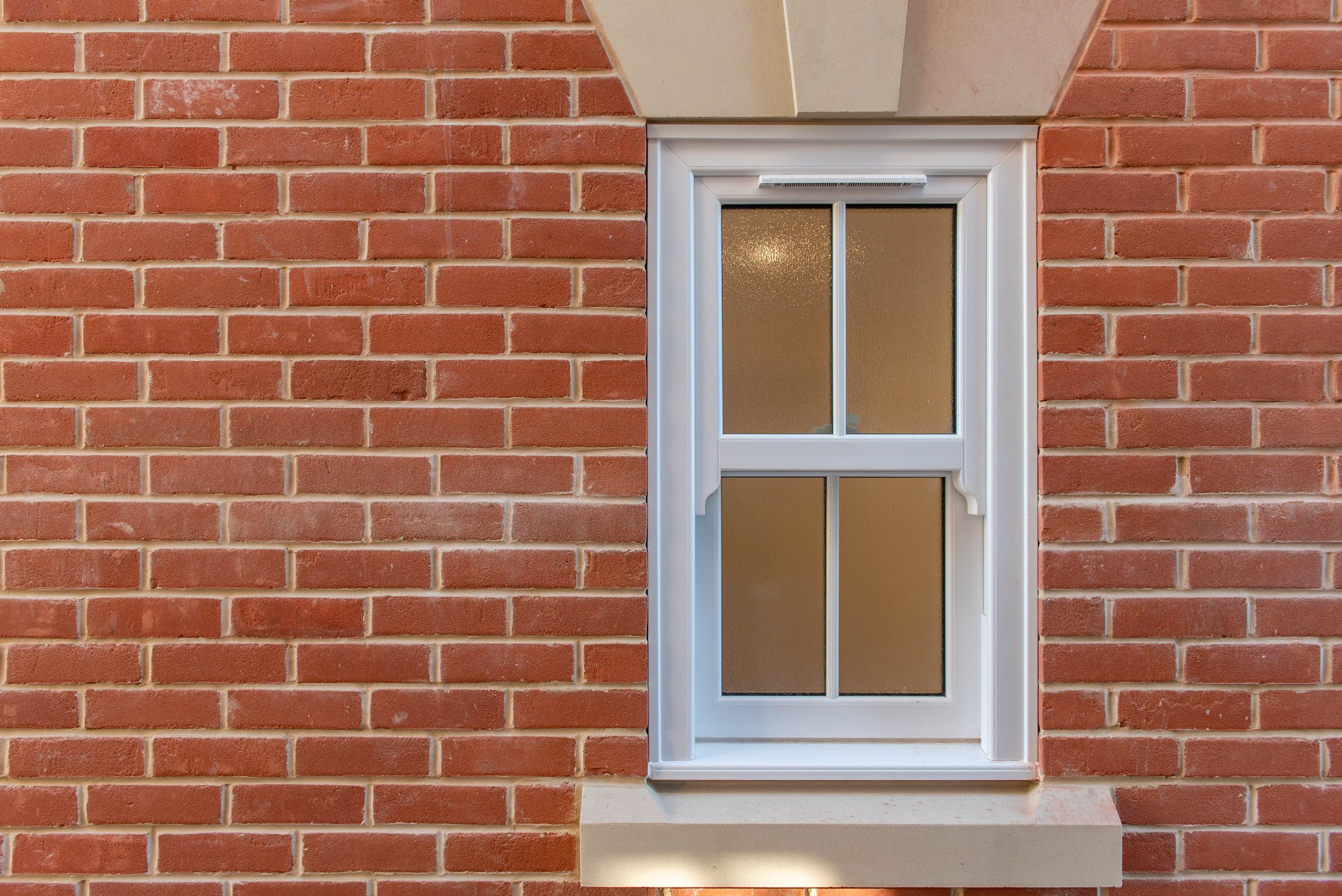White uPVC sliding sash window on red brick, Windows Etc Colchester