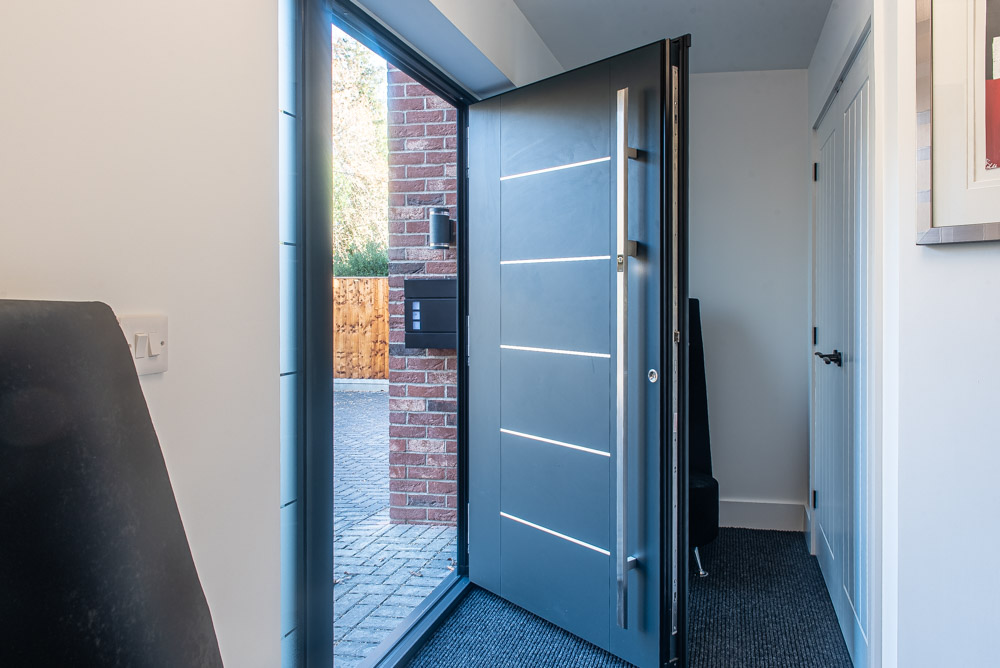 Blue Solidor composite front door with wisteria, Windows Etc Essex