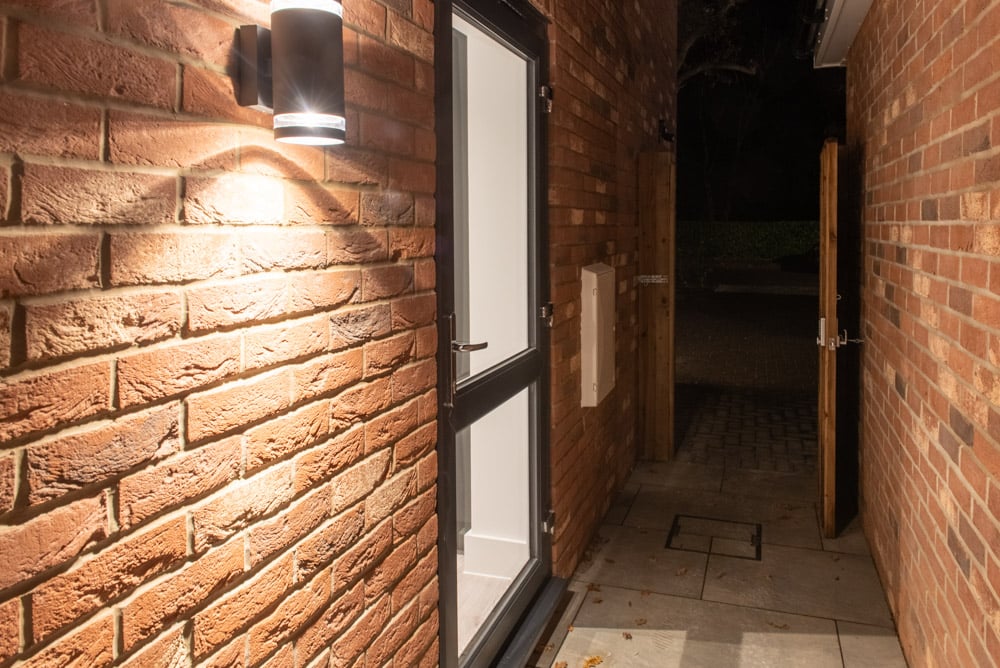 Kitchen-diner with bi-folding doors open to the outdoor space