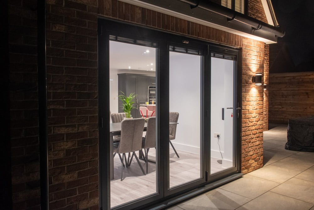 Anthracite uPVC flush sash windows on the rear of the Colchester new-build