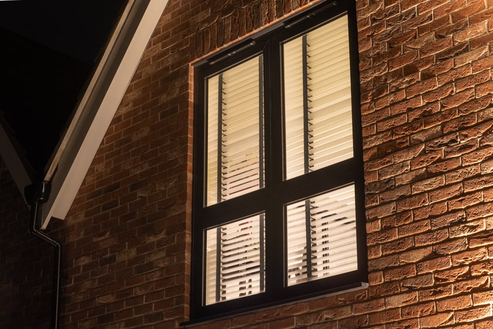 Full-height uPVC flush sash glazing in a rear bedroom of the Colchester new-build