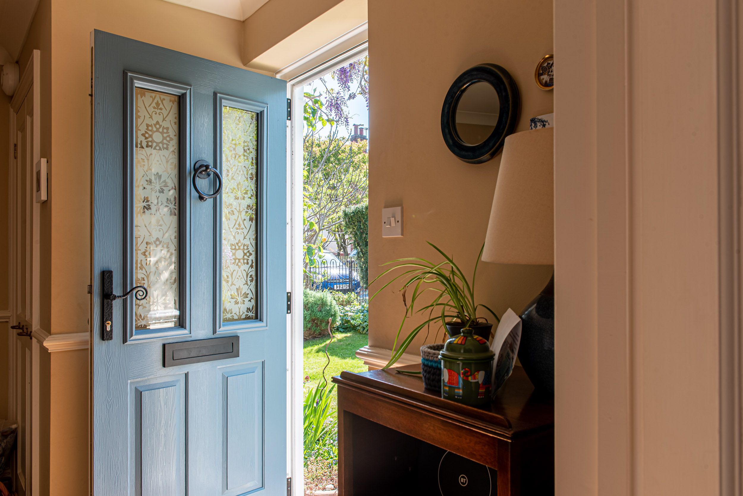 Blue Solidor composite front door open to hallway, Windows Etc Essex