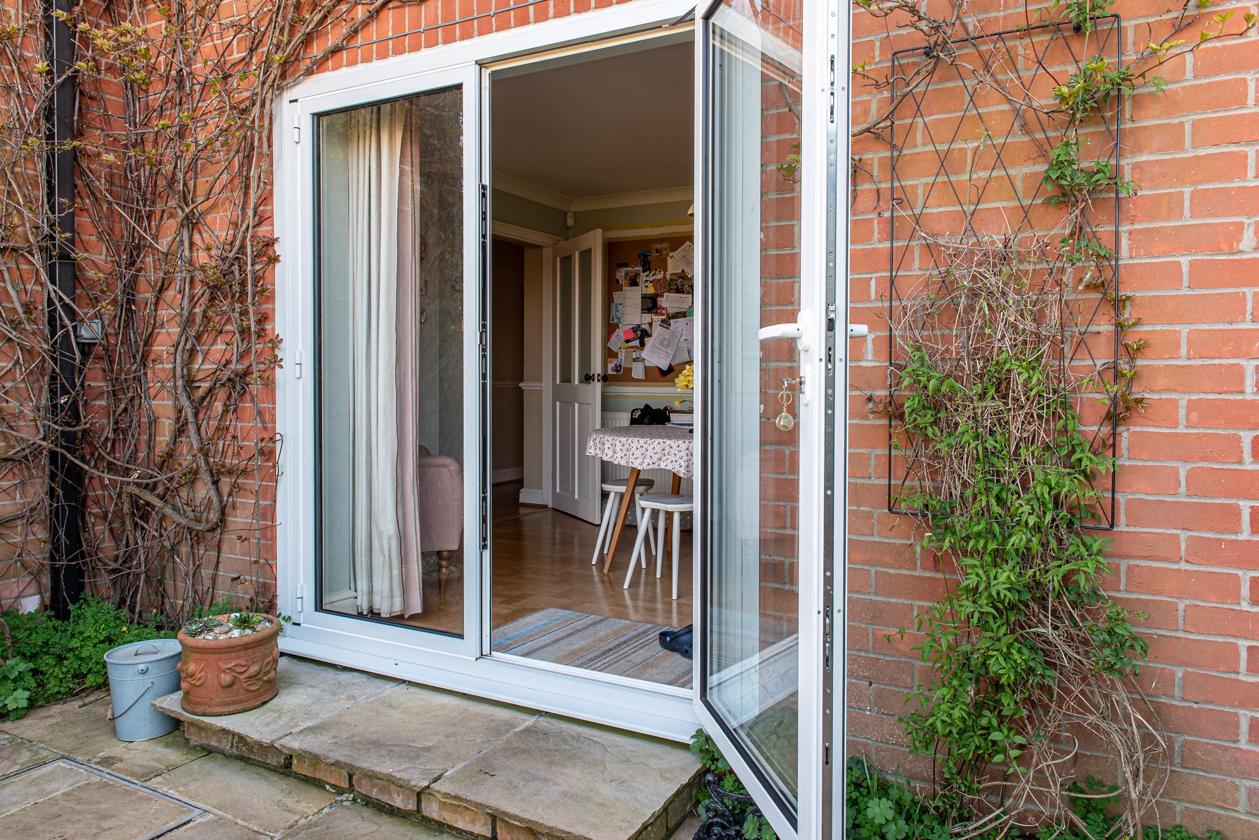 Origin aluminium two-leaf bifold doors in dining area
