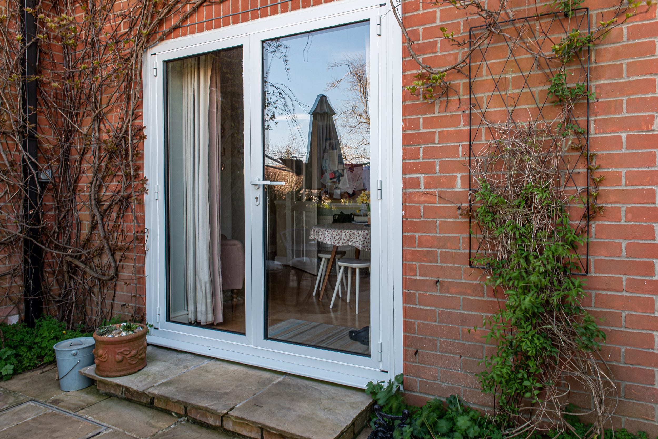Origin aluminium bifold doors opening onto rear garden