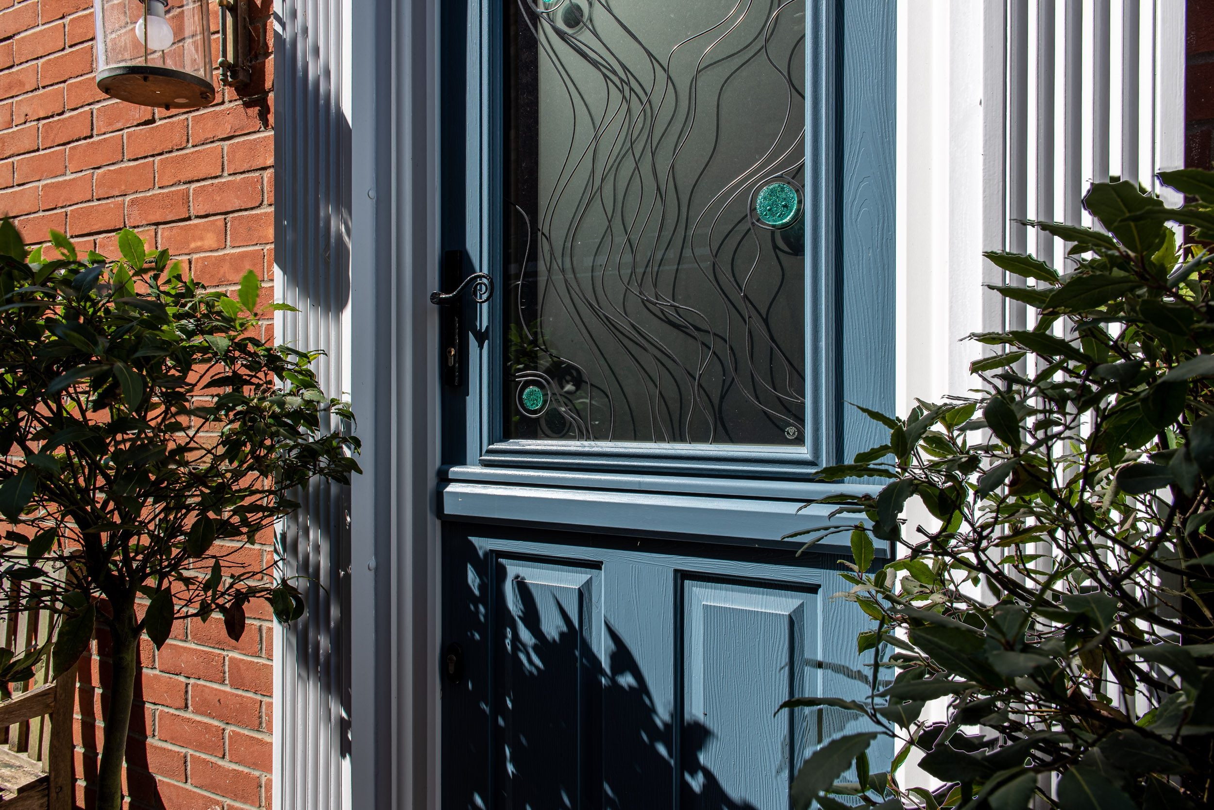 Front door entrance with Solidor composite door and traditional ironmongery