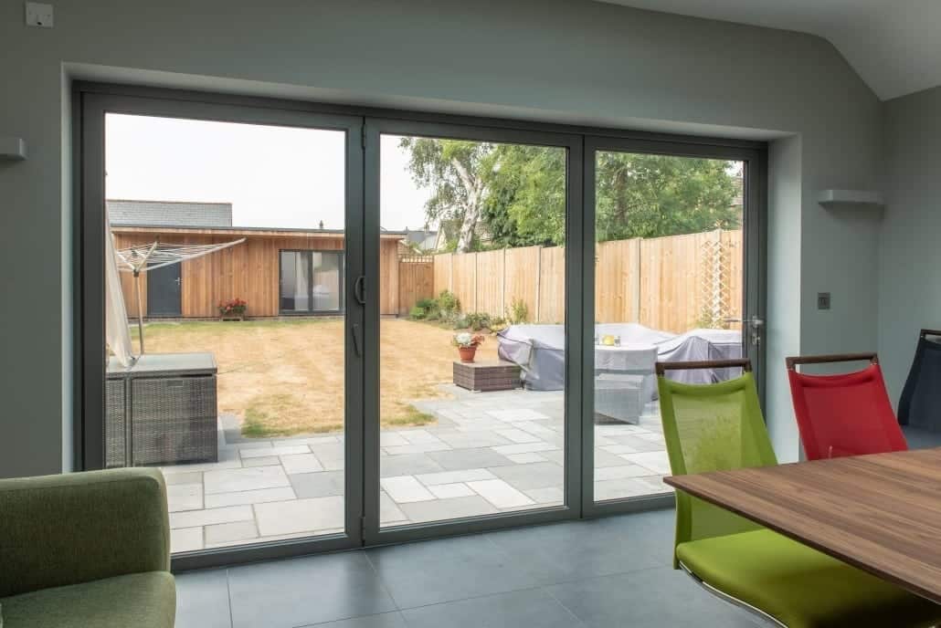 Self-build property exterior showing coordinated glazing across front elevation