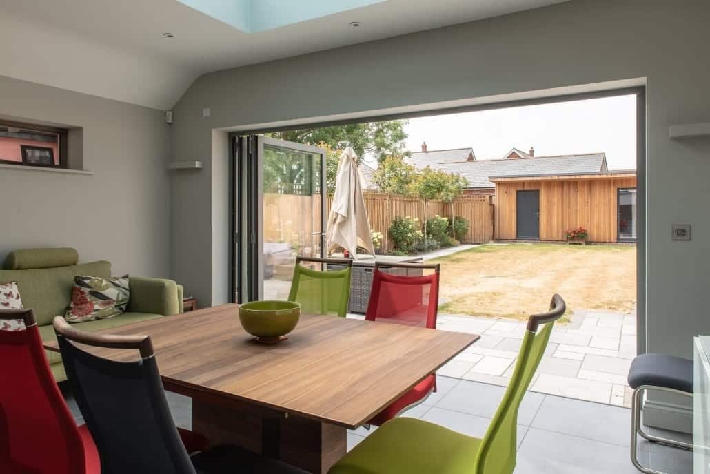 Rear of self-build showing bifold doors and garden access