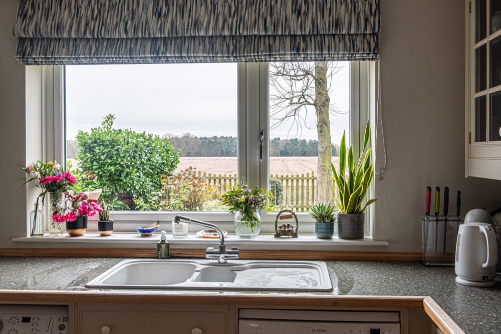 Flush sash windows and Origin bi-fold doors on a detached Suffolk countryside house finished in Agate Grey