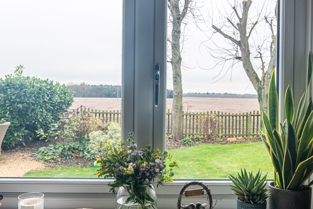 Rear elevation showing Origin bi-fold doors installed in dining room and kitchen, Agate Grey finish