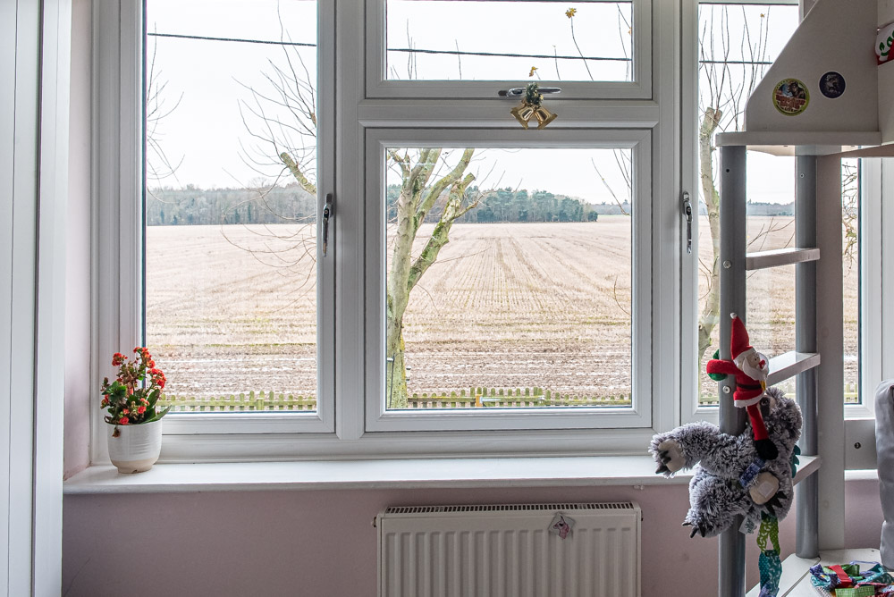 White flush casement window above radiator, Windows Etc Essex