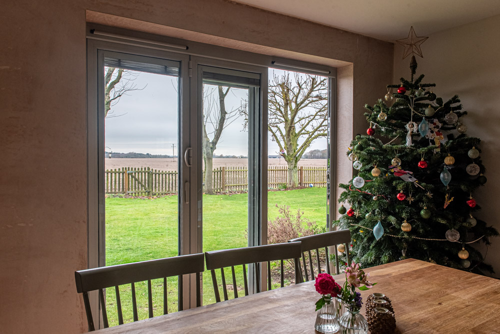 Origin bi-fold doors with stainless steel handles and colour-coded hinges, Agate Grey exterior
