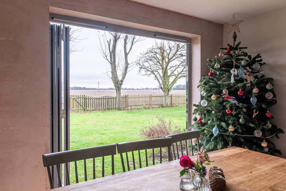 Kitchen bi-fold doors with integral slider control blinds fitted