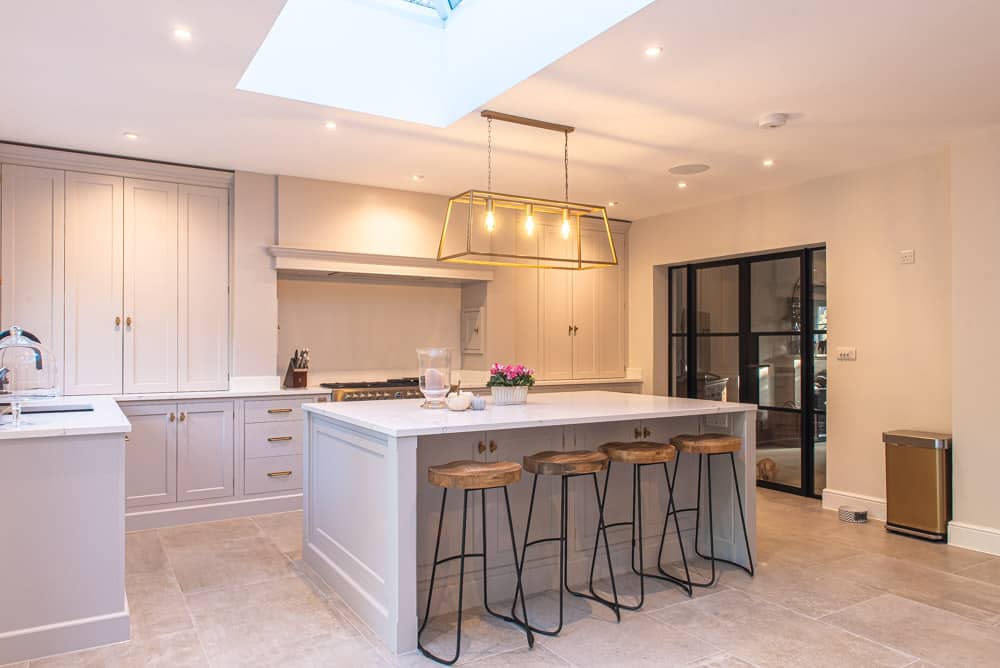 Full width bifold doors connecting Colchester extension to outdoor terrace