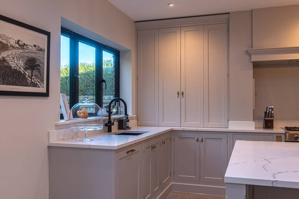 Glazed kitchen extension interior showing roof lantern and bifold doors