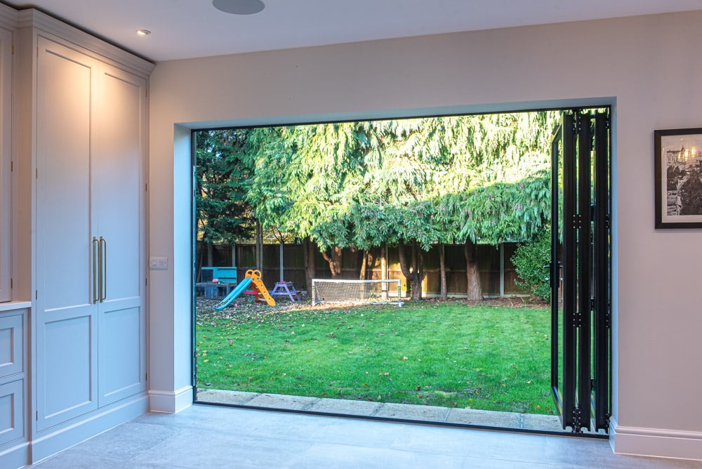 Aluspace internal door screen with double doors and sidelites connecting extension to hallway