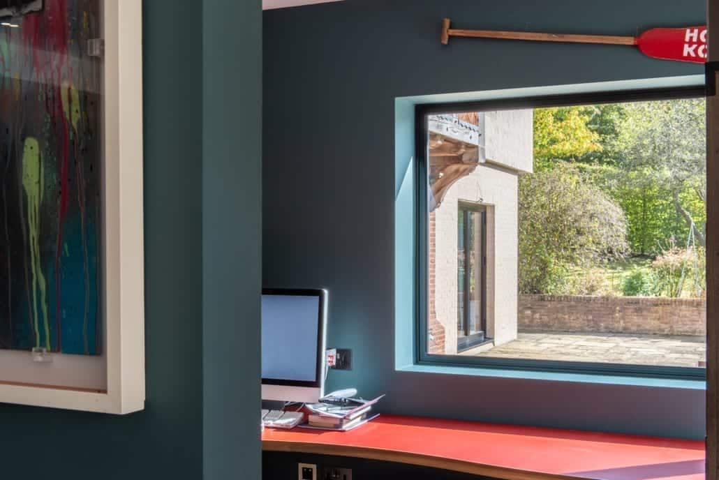 Crittall door detail showing the reassuring weight of powder-coated steel and crafted welds