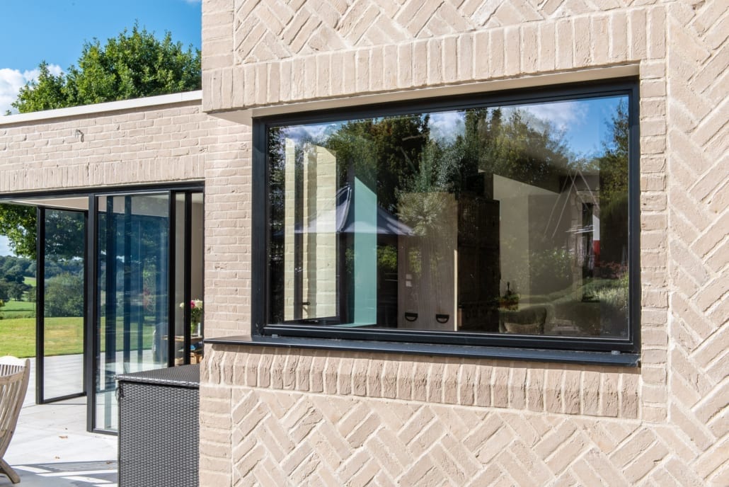 Wide view of the extension showing Heritage windows and the herringbone brick detail