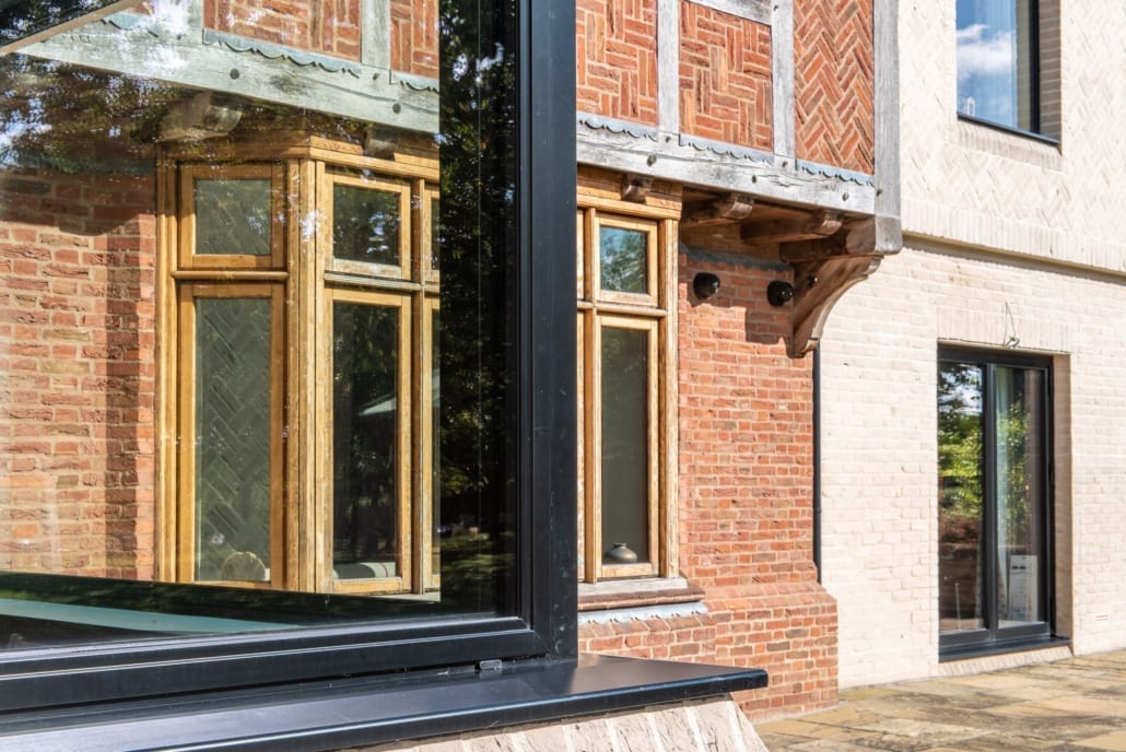Crittall interior partition with black powder-coated steel and glazing bars
