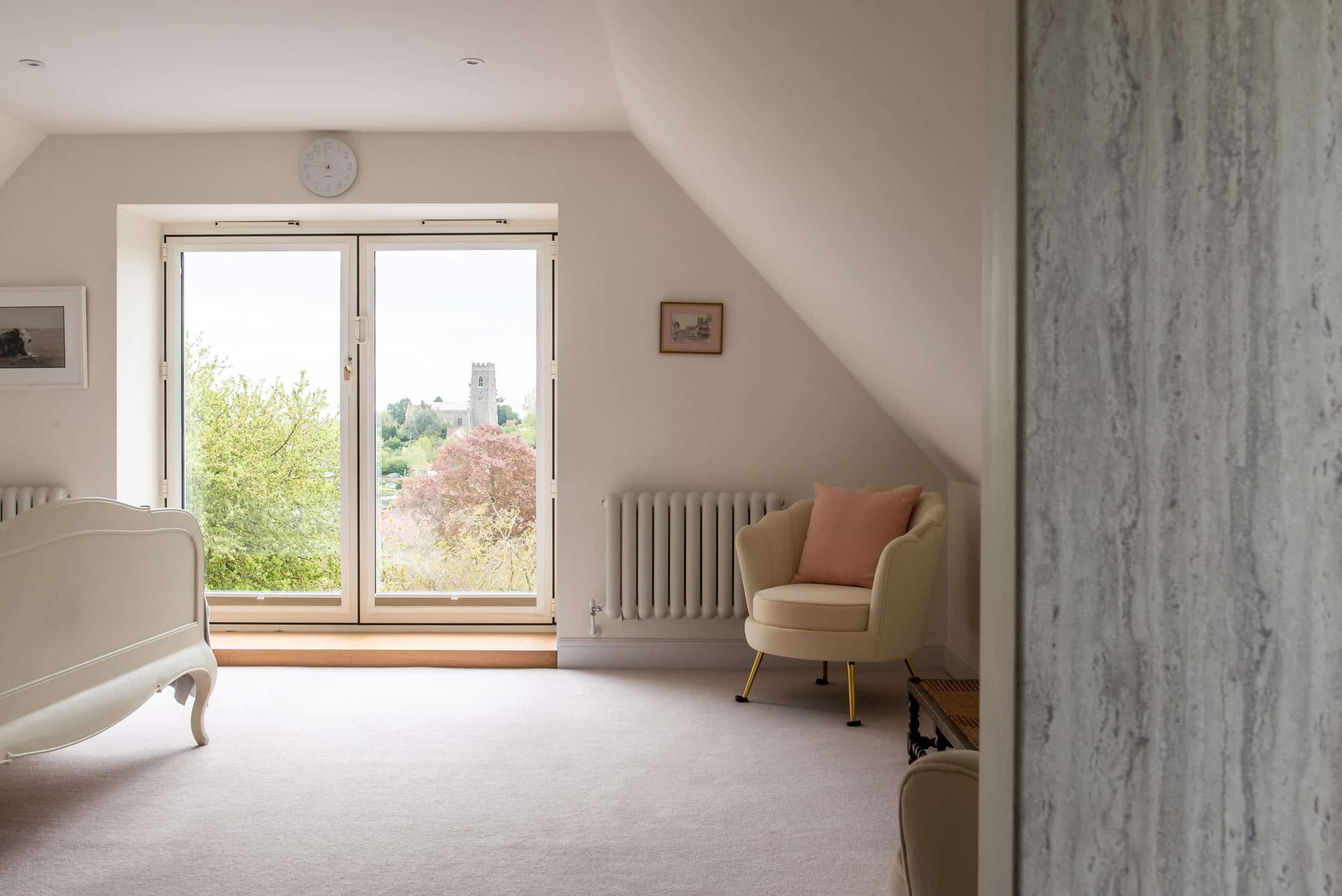 Gymnasium interior with Smarts aluminium picture window overlooking Suffolk village