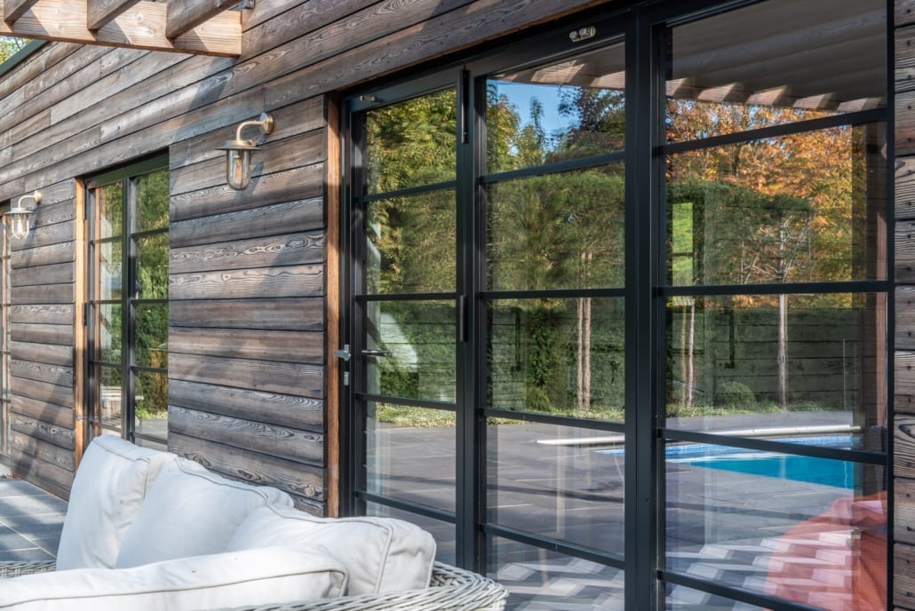 Close-up of face-fixed astragal bars on aïr bifold doors, pool house project