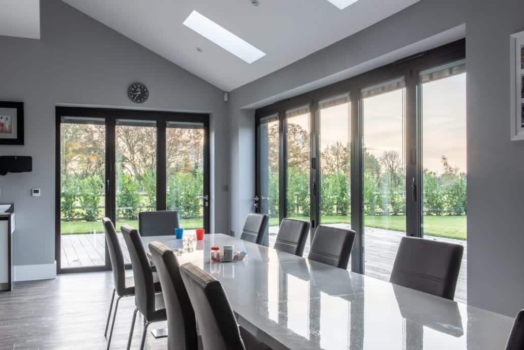 Open plan dining with aluminium windows and bifold doors, Essex