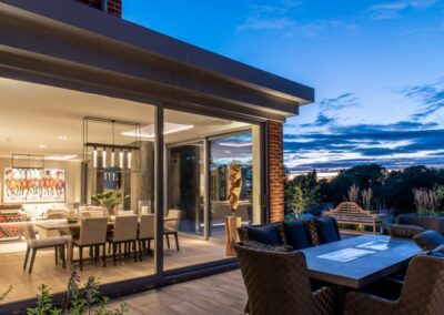 Open-plan kitchen and living space with aïr doors and Vitral roof lights, Suffolk