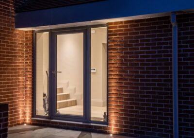 Wide-span aïr sliding doors in open position, RIBA Suffolk Award-winning new-build