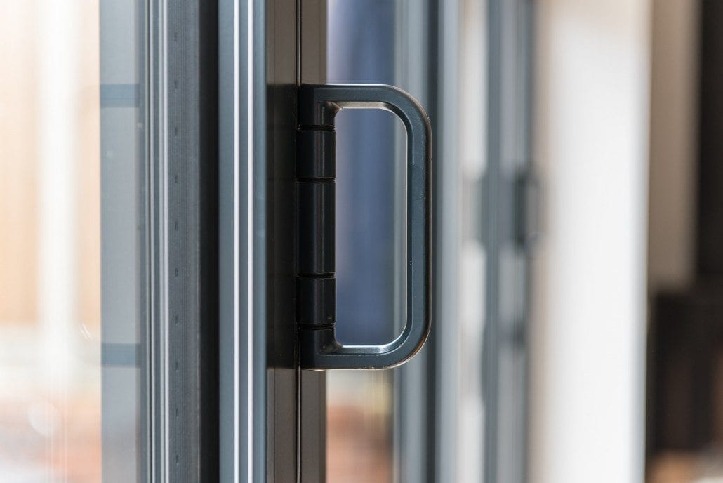 Dark grey aluminium window detail on coastal chalet