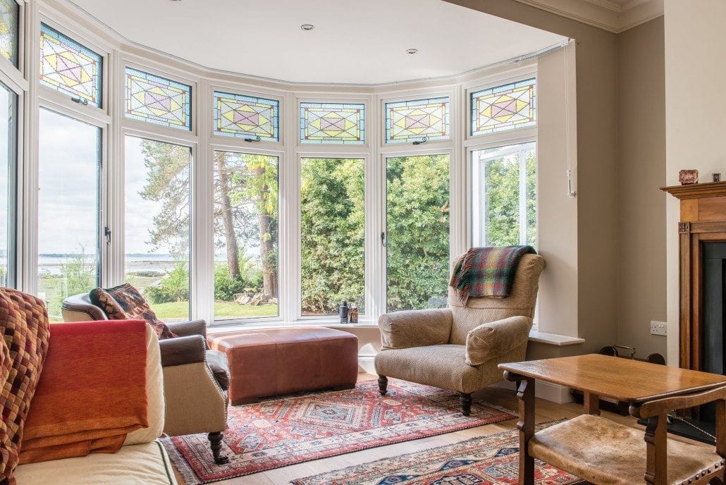Interior view through aluminium bifold doors to garden