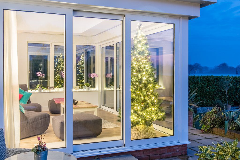 Sliding doors and glazed extension rear elevation on a riverside property