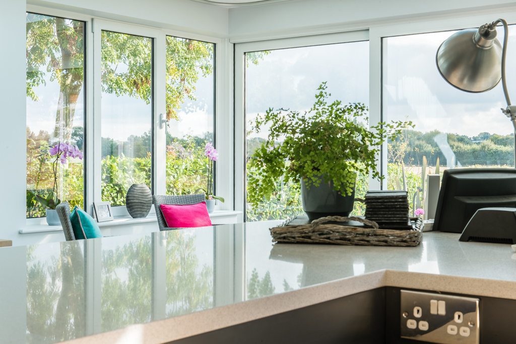 Glass box extension with sliding doors on a 1970s chalet conversion