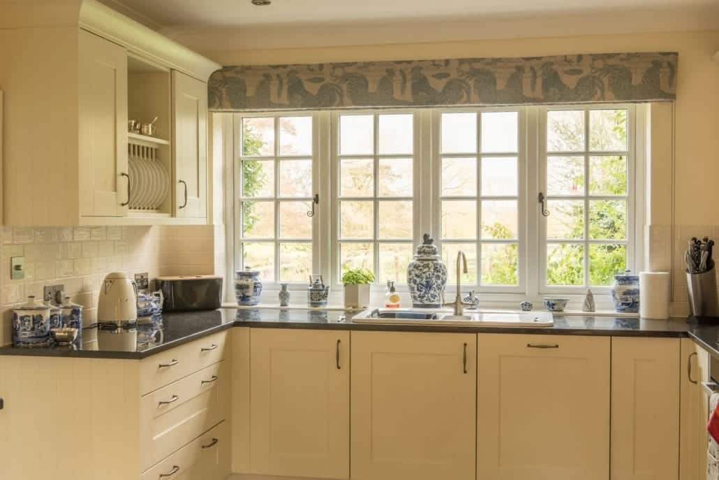 uPVC stormproof windows in traditional timber-effect profiles on a rural English country property