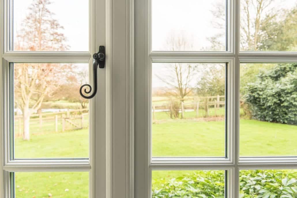 uPVC stormproof window with Radlington deep cill detail on traditional red-brick rural property