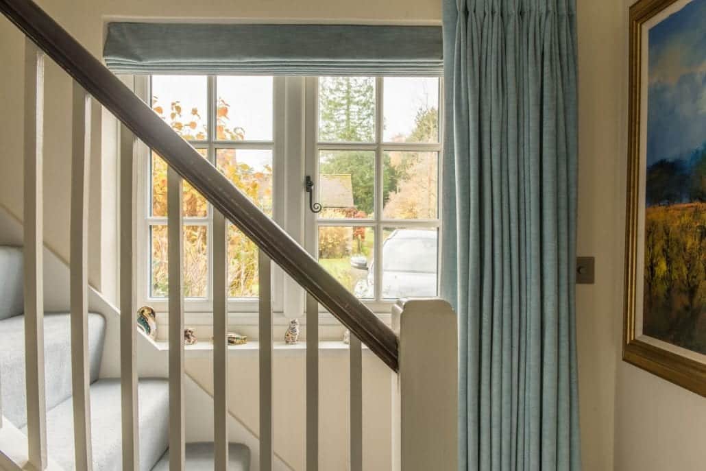 uPVC stormproof casement windows installed on rendered and brick country house facade
