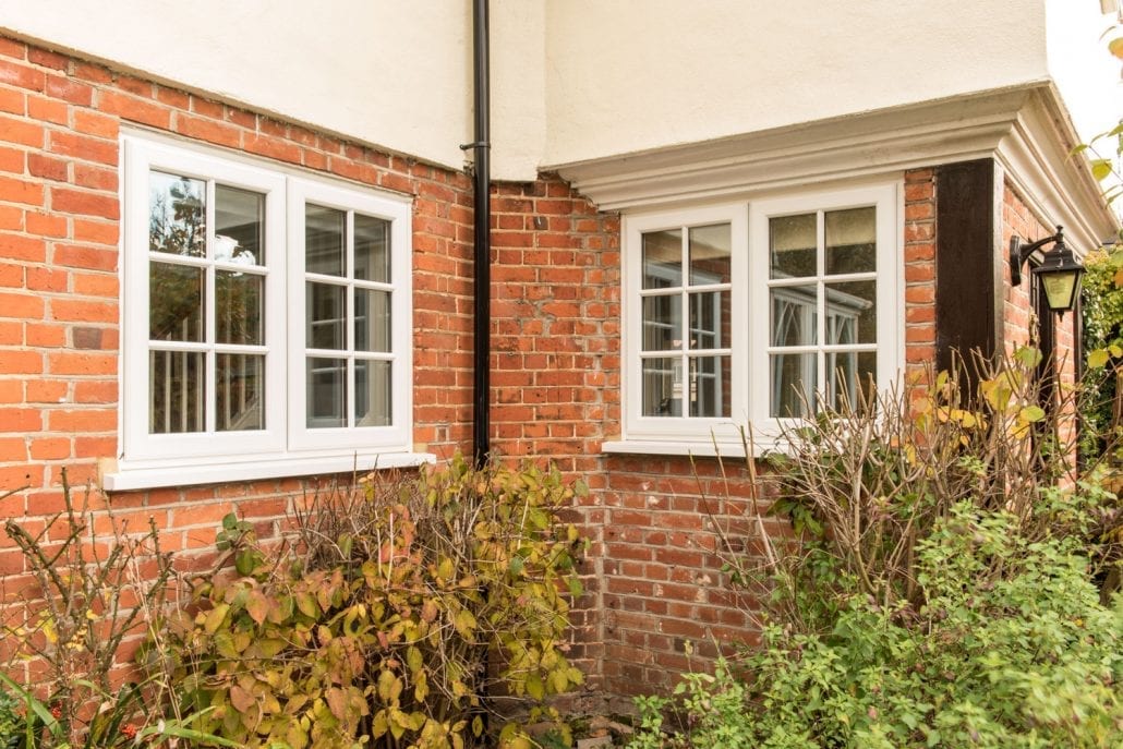 Cream uPVC casement windows on red brick corner, Windows Etc Essex