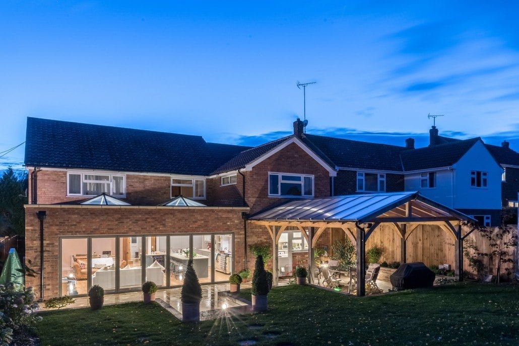 Home at dusk with lit Atlas roof lantern extension, Coggeshall Essex