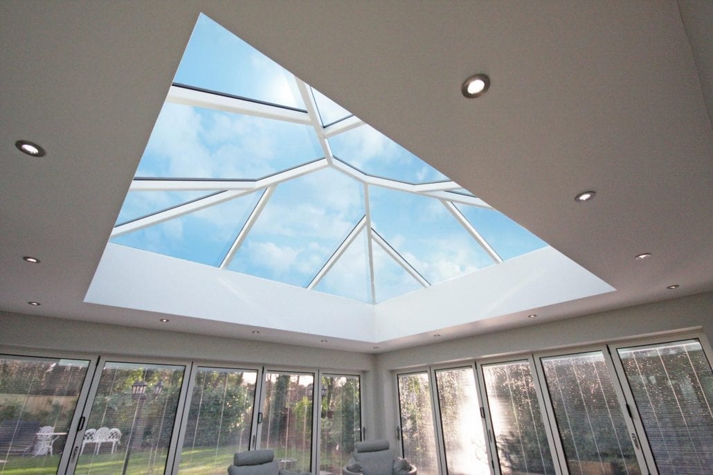 Roof lantern with blue sky above a garden room