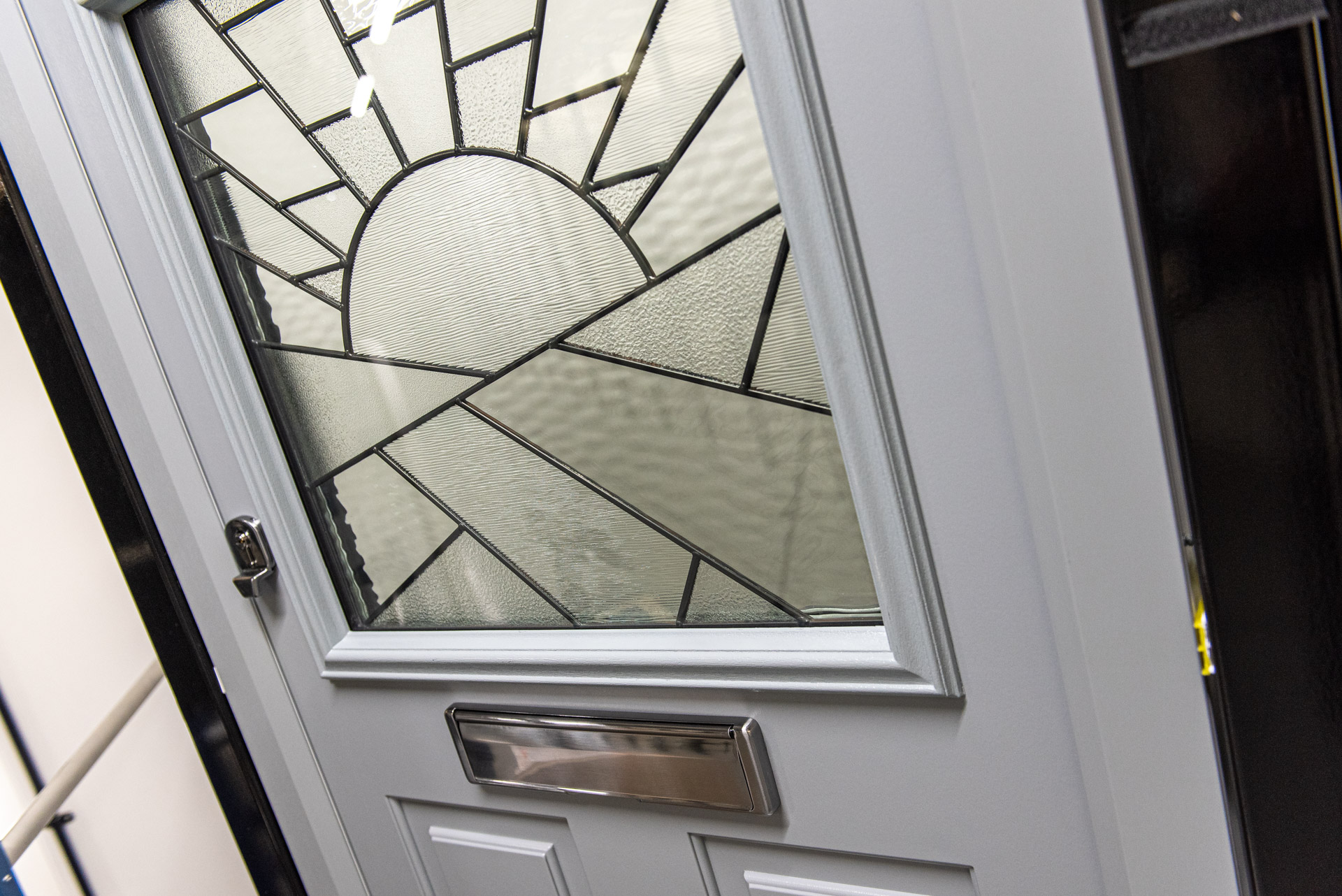 Comp Door sunburst glazed panel detail, Windows Etc showroom