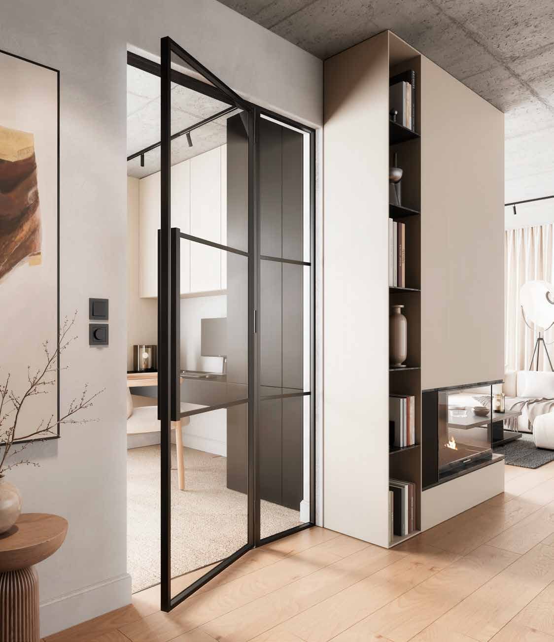 Black steel and glass hinged door standing open between a living room and a hallway